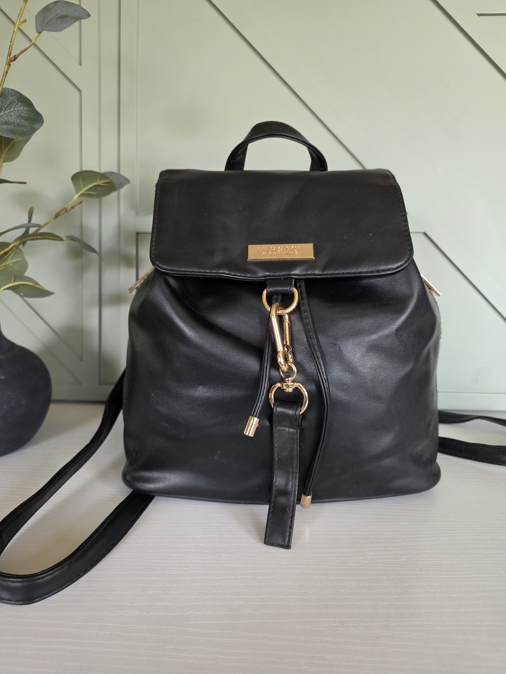 Versace Parfums Black and Gold Drawstring Backpack,